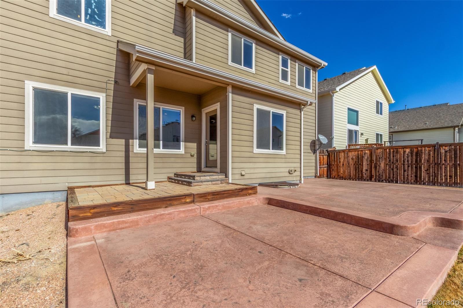 6654 12th Street Frederick, CO 80530 - Photo 46 of 50 a front view of a house with a yard