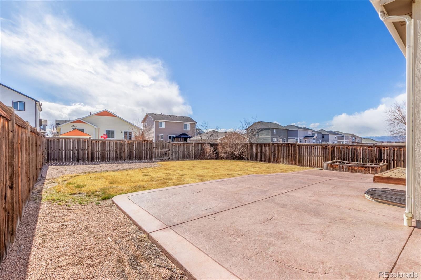 6654 12th Street Frederick, CO 80530 - Photo 47 of 50 a view of swimming pool with outdoor seating and yard in back
