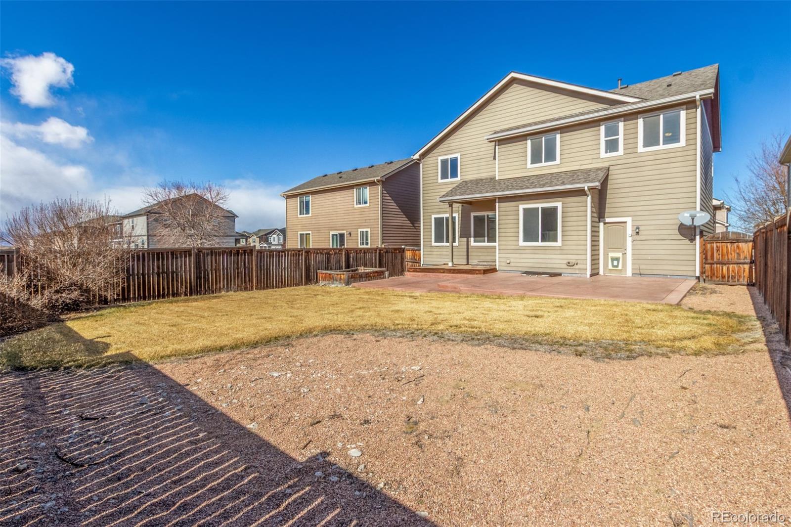 6654 12th Street Frederick, CO 80530 - Photo 48 of 50 a swimming pool with trees in the background