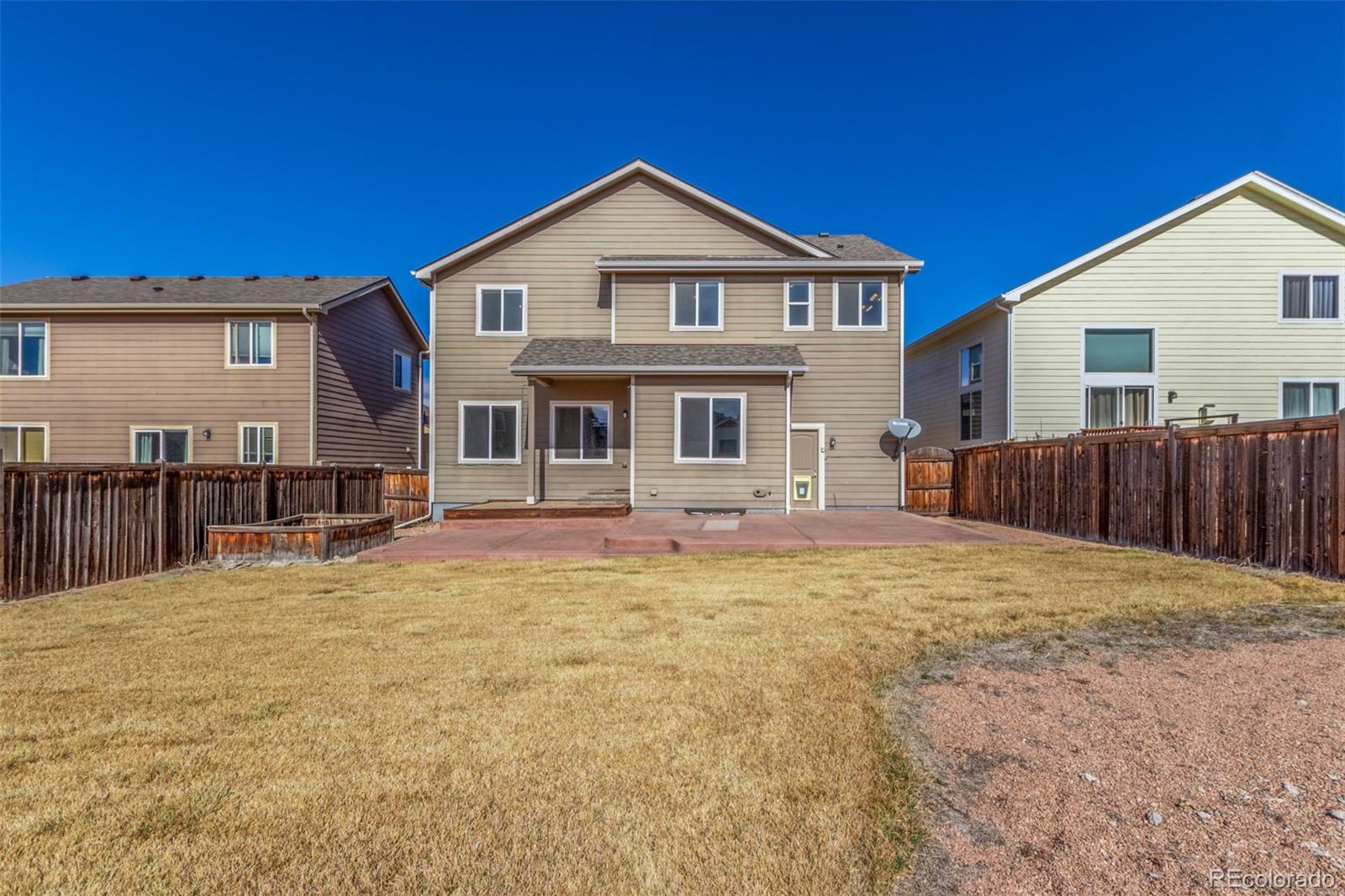 6654 12th Street Frederick, CO 80530 - Photo 49 of 50 a swimming pool with outdoor seating and yard