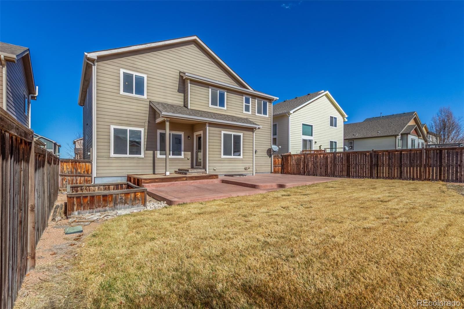 6654 12th Street Frederick, CO 80530 - Photo 50 of 50 a view of a house with backyard and sitting area