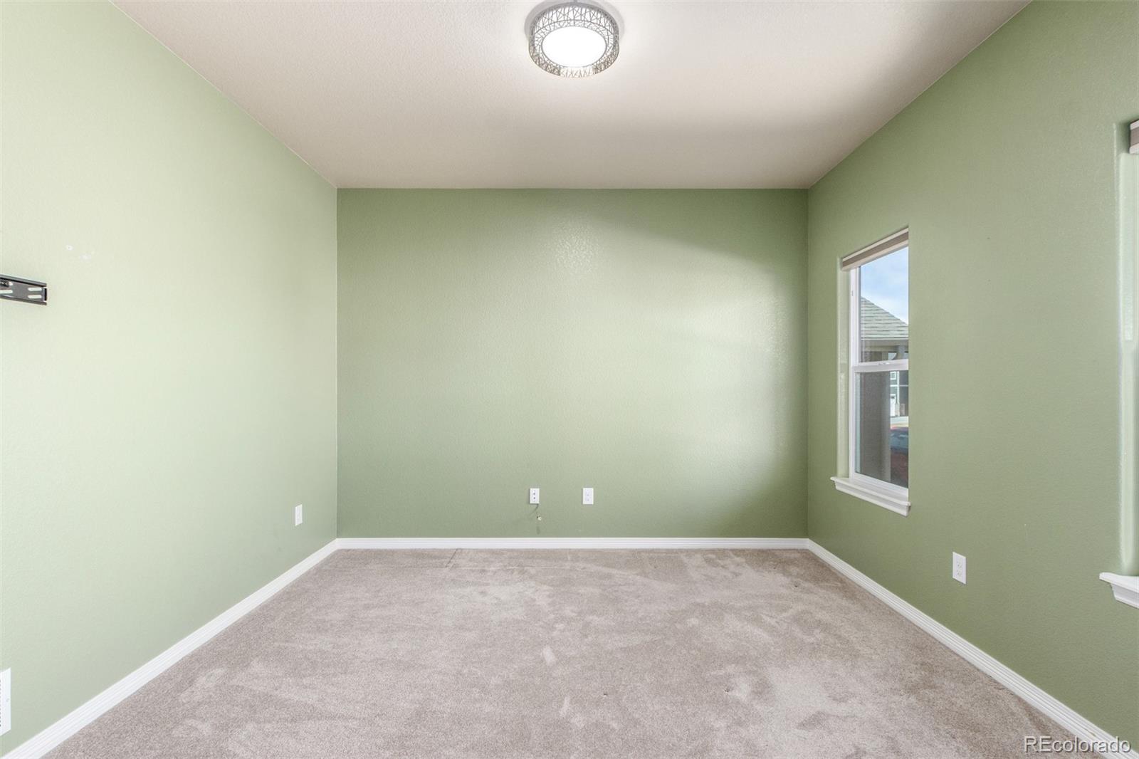 6654 12th Street Frederick, CO 80530 - Photo 5 of 50 an empty room with a window