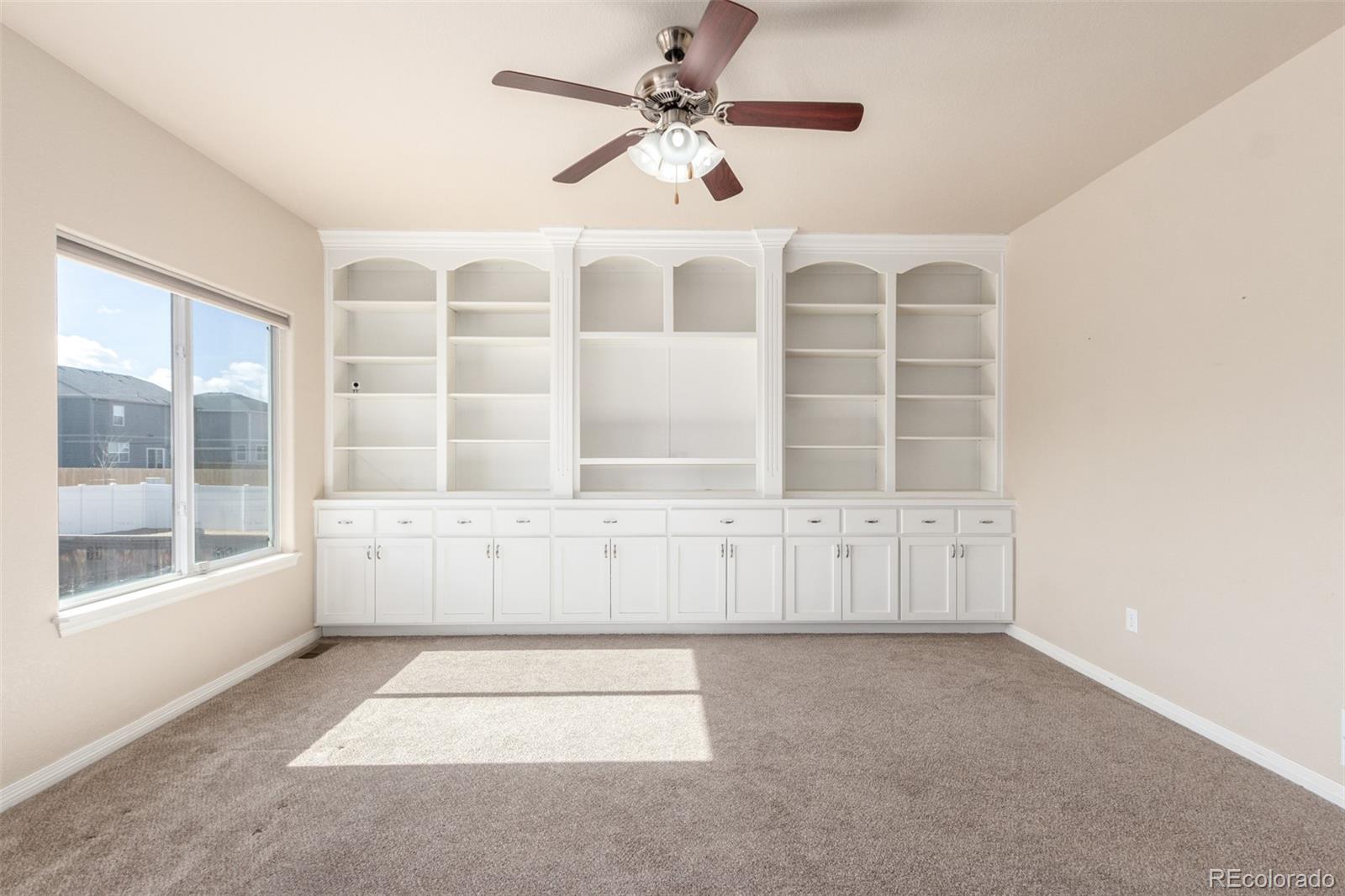 6654 12th Street Frederick, CO 80530 - Photo 8 of 50 a view of an empty room with a window