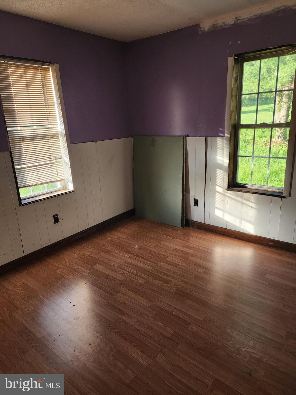 466 Kirks Mill Road Nottingham, PA 19362 - Photo 17 of 28 an empty room with wooden floor and windows