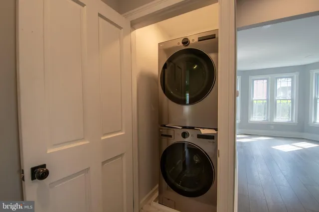 an aerial view of a house with garden space and street view