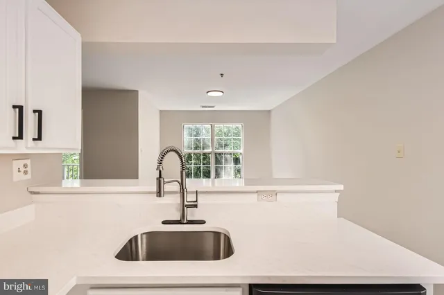a kitchen with a sink and a window