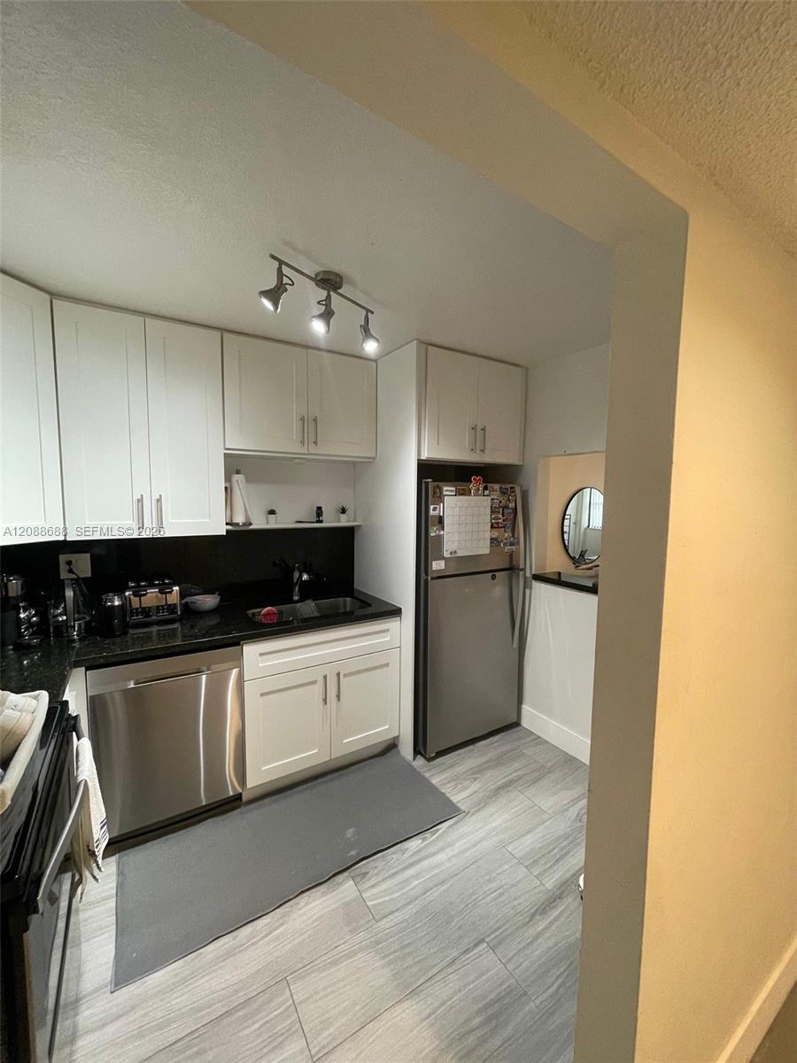 303 Racquet Club Road, Unit 311 Weston, FL 33326 - Photo 6 of 9 Gallery Image 6