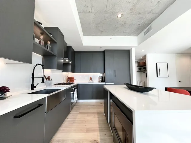 a kitchen with a sink and stove