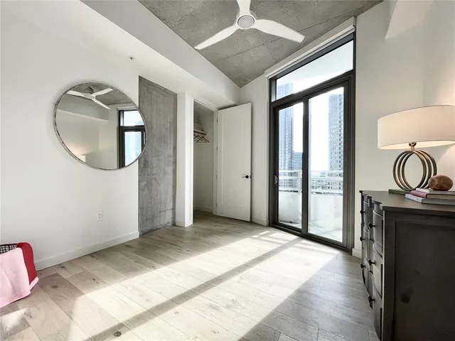 a view of a livingroom with furniture and hardwood floor
