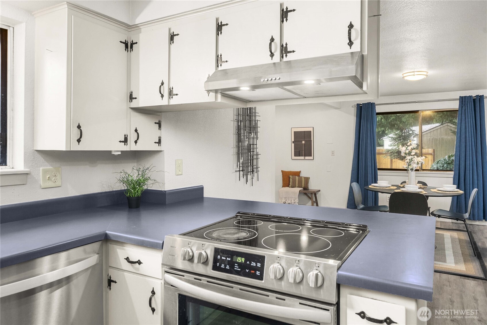152 Christina Drive Sumner, WA 98390 - Photo 15 of 26 a kitchen with stove and cabinets