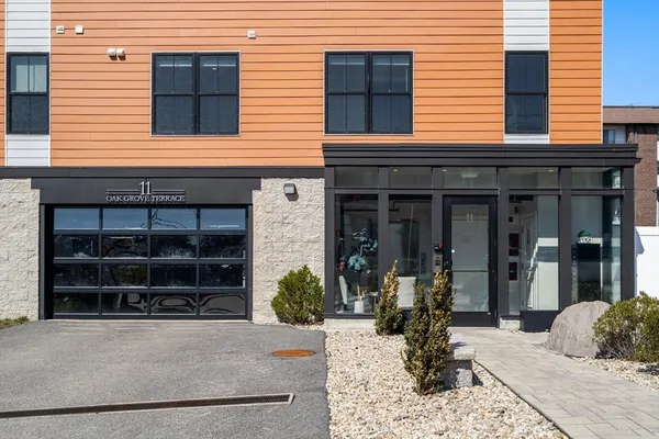 a view of a house with a window and sitting area