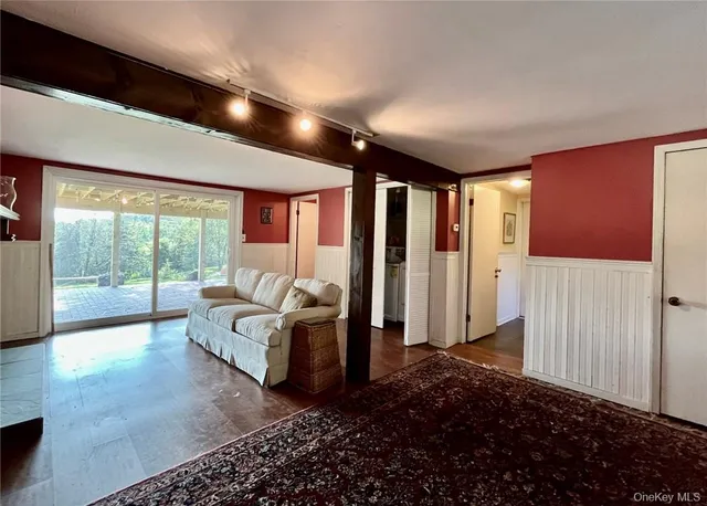 a spacious bedroom with a large bed and a large window