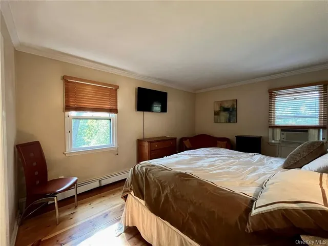 a bedroom with a bed and a chair