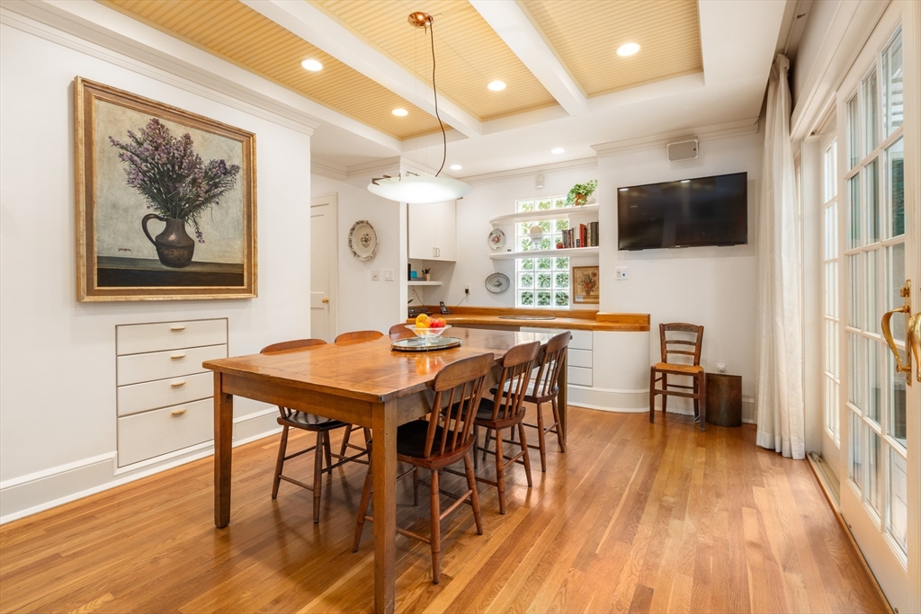 26 Healey Street Cambridge, MA 02138 - Photo 13 of 24 a view of a dining room with furniture and wooden floor