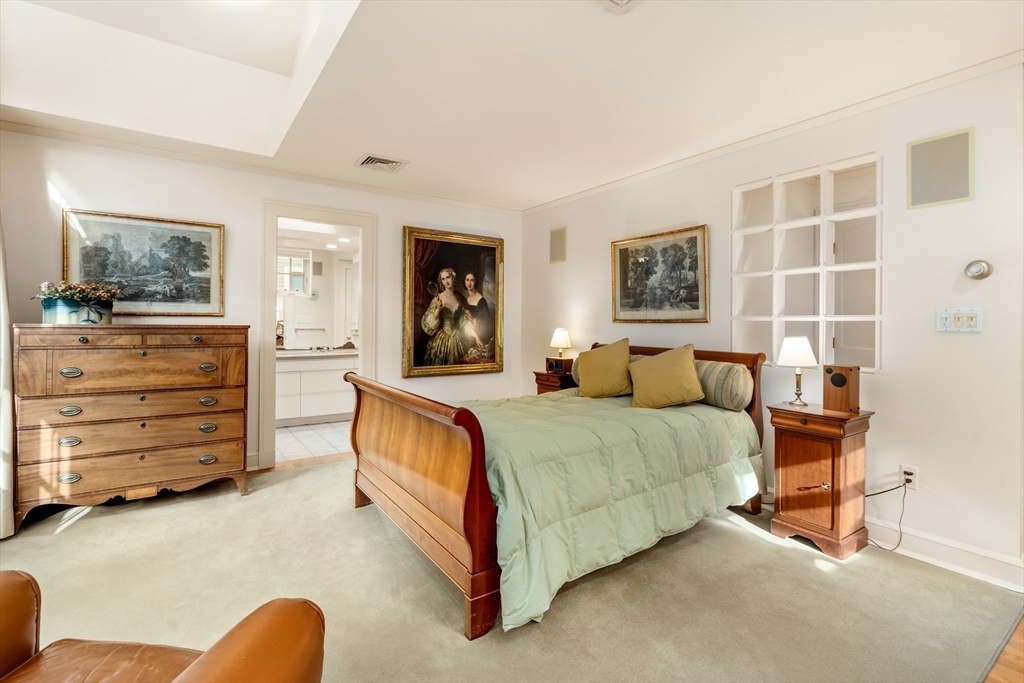 26 Healey Street Cambridge, MA 02138 - Photo 15 of 24 a spacious bedroom with a bed and cabinet
