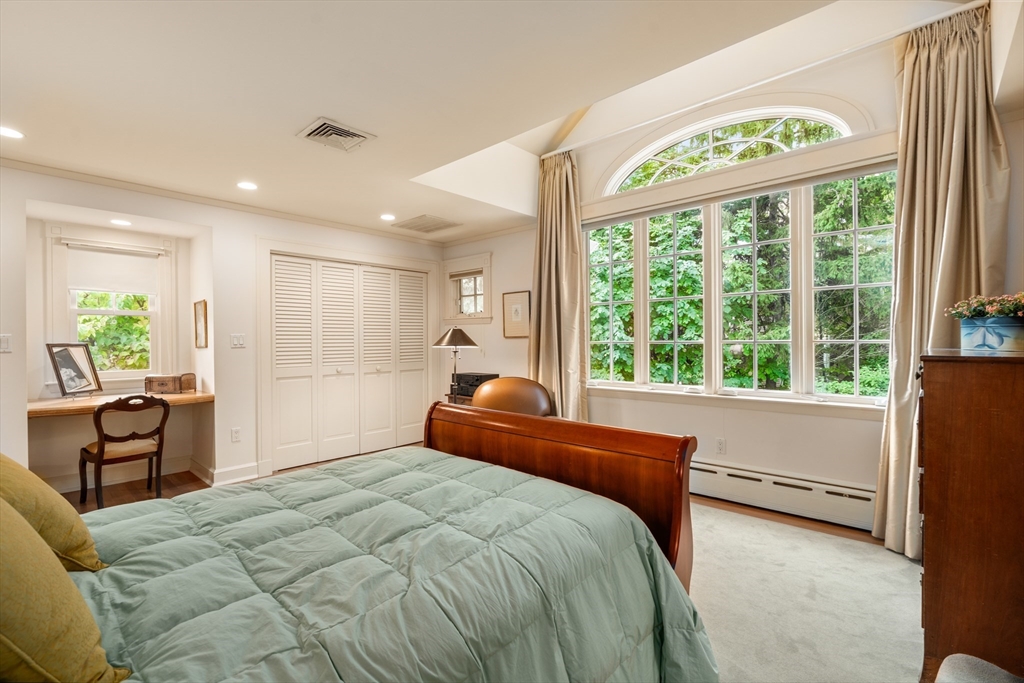 26 Healey Street Cambridge, MA 02138 - Photo 16 of 24 a bedroom with a large bed and windows