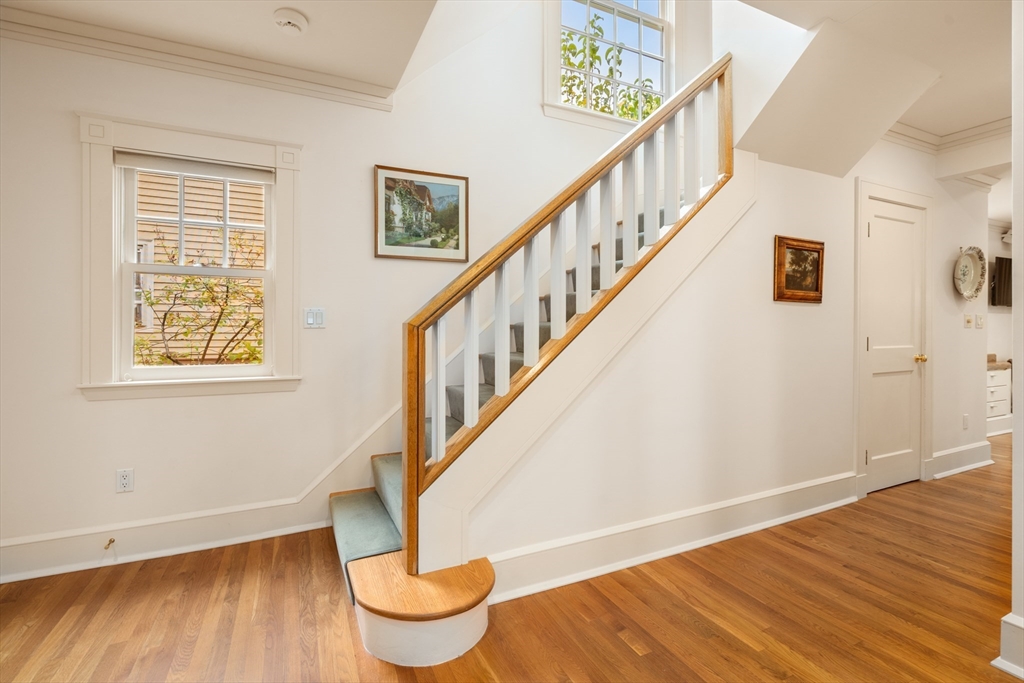 26 Healey Street Cambridge, MA 02138 - Photo 2 of 24 a view of entryway with wooden floor and stairs