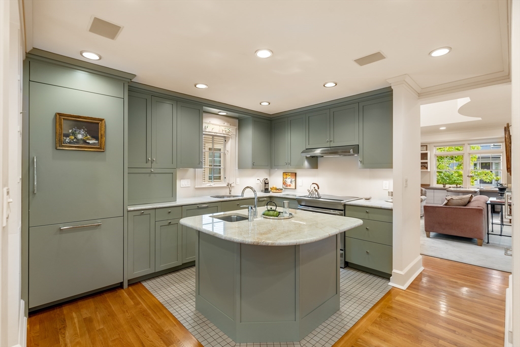 26 Healey Street Cambridge, MA 02138 - Photo 8 of 24 a kitchen with stainless steel appliances granite countertop a sink and a refrigerator