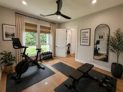 a view of a livingroom with furniture window and wooden floor