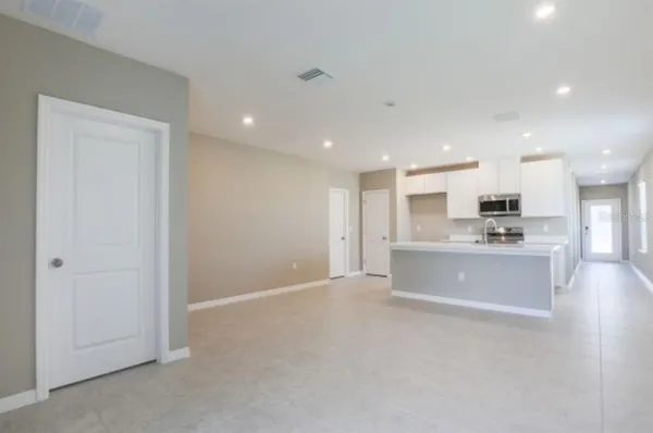 a view of an empty room with a window