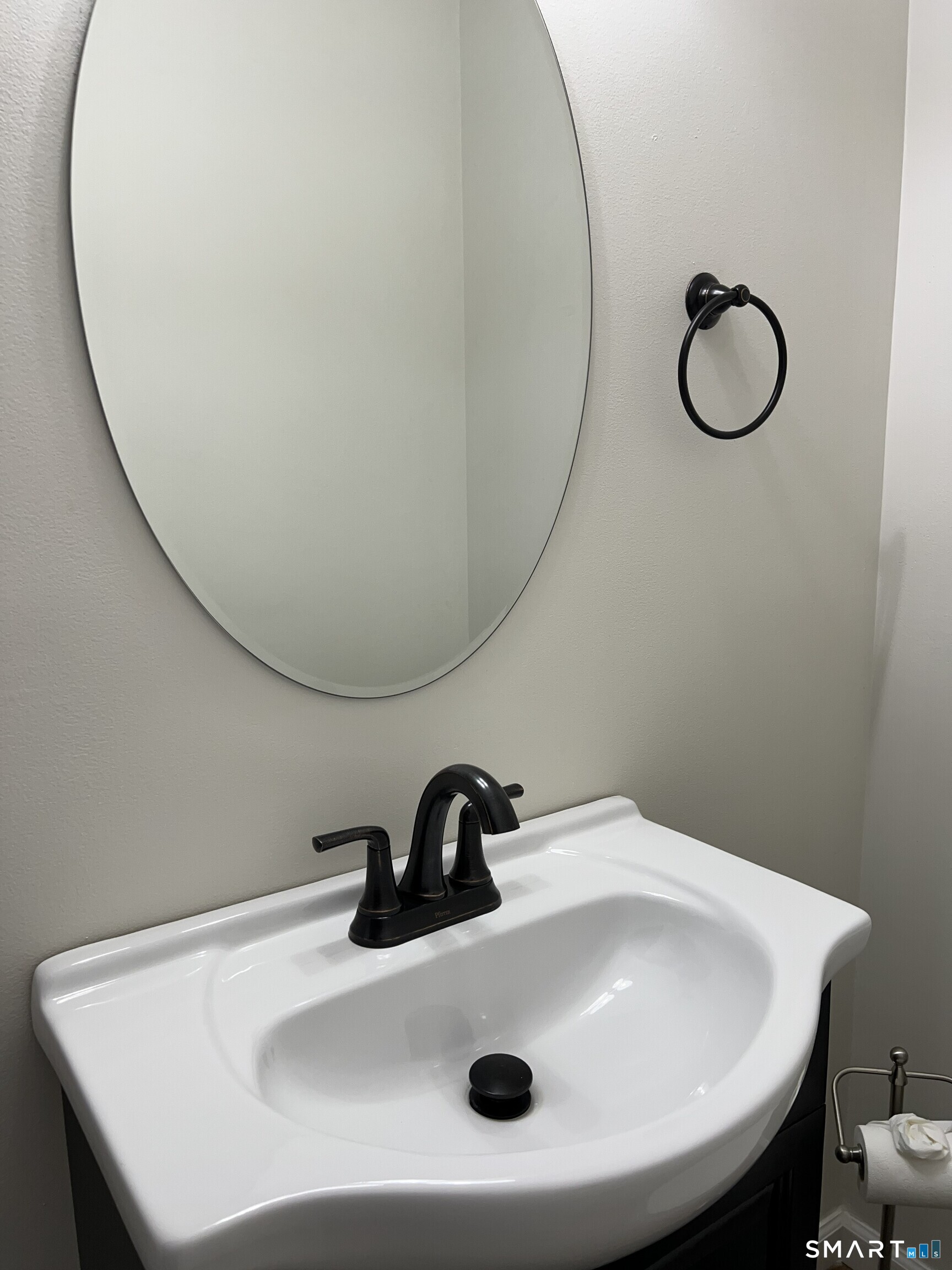 82 Bingham Street Bristol, CT 06010 - Photo 19 of 40 a bathroom with a sink and a mirror