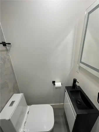 a bathroom with a toilet and a sink