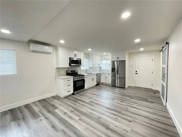 a view of kitchen with wooden floor