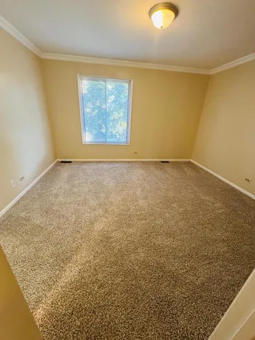 an empty room with a empty space and window