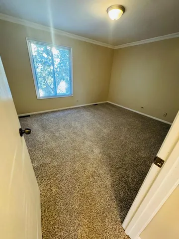 a view of an empty room and windows