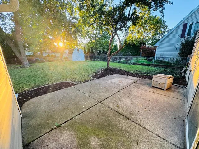 a view of backyard with outdoor seating