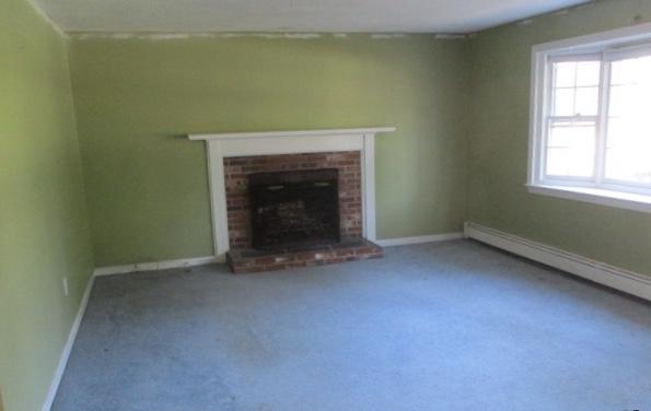 445 Nye Road Centerville, MA 02632 - Photo 3 of 7 an empty room with a fireplace