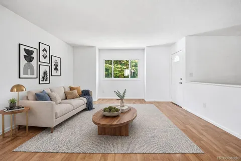 a living room with furniture and window