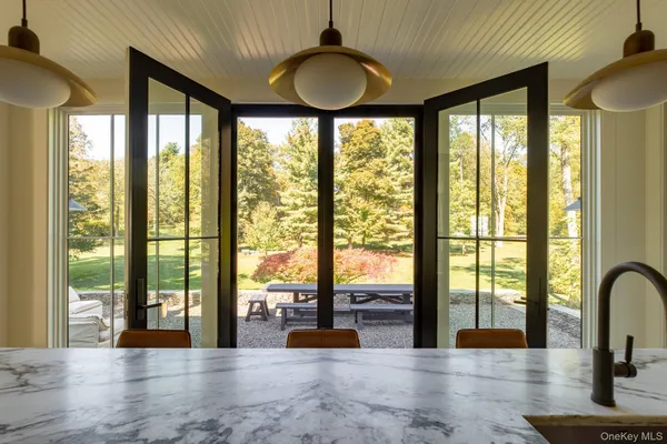a view of lobby with furniture and large windows