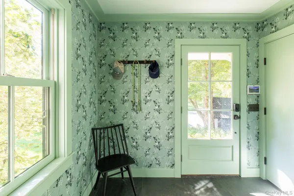a view of a entryway door with wooden floor