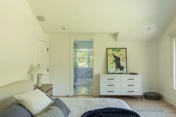 a bedroom with a bed and furniture