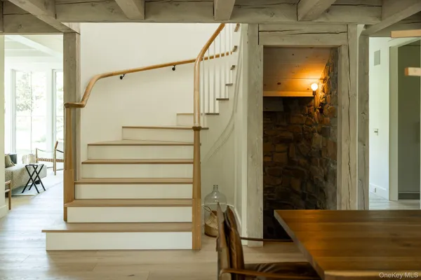 a view of entryway with wooden floor and windows