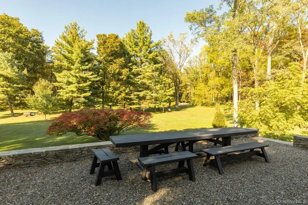 a view of a yard with furniture and a yard