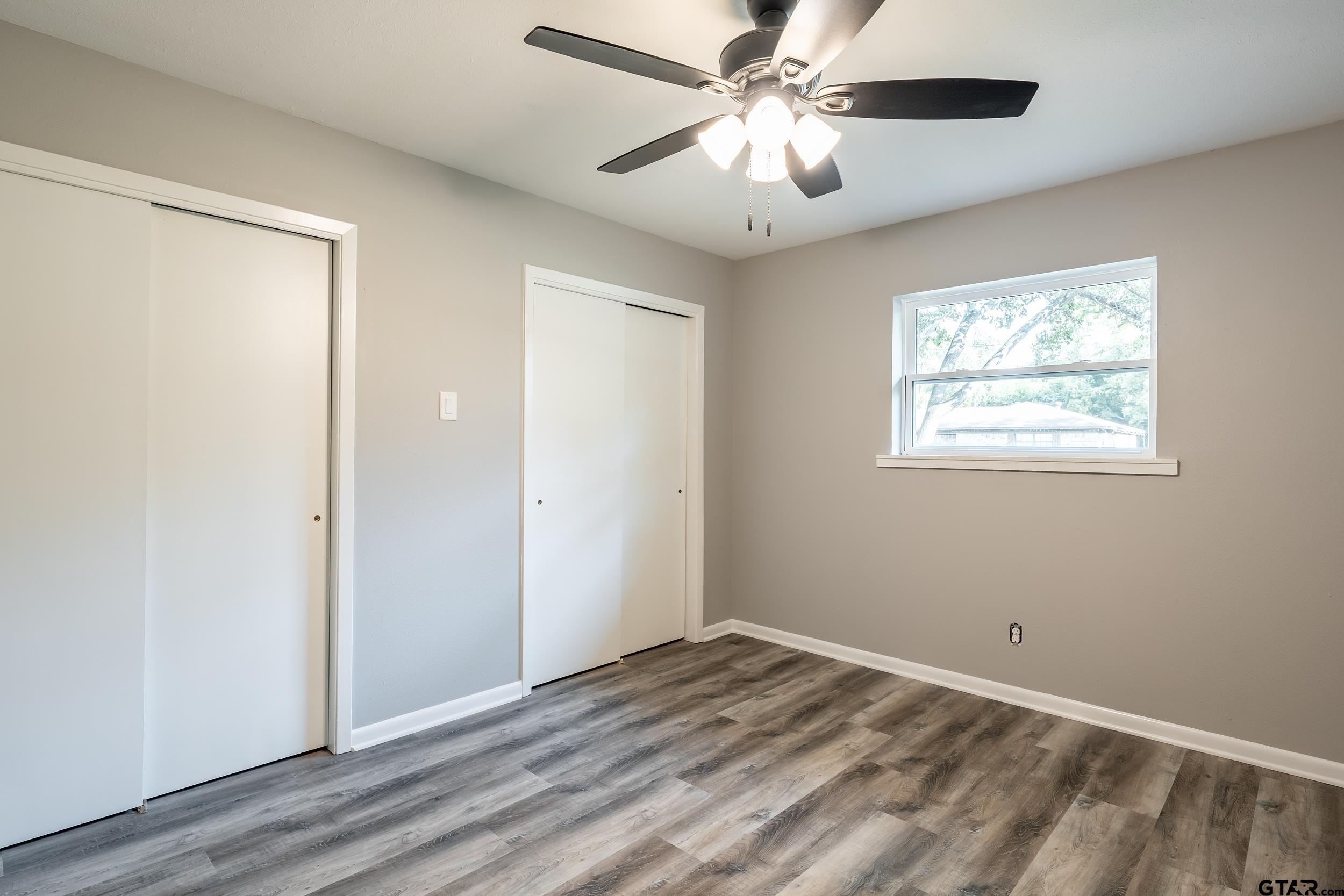 2201 King Road Jacksonville, TX 75766 - Photo 15 of 24 a view of empty room with wooden floor and fan