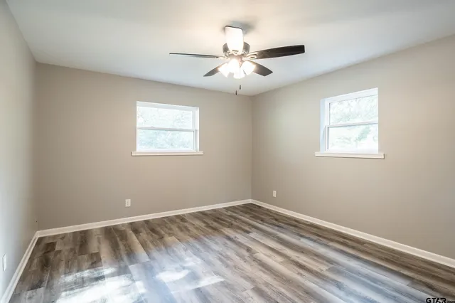 a view of room with window and ceiling fan