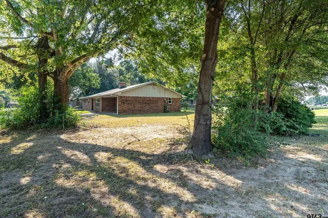 a house with trees in front of it