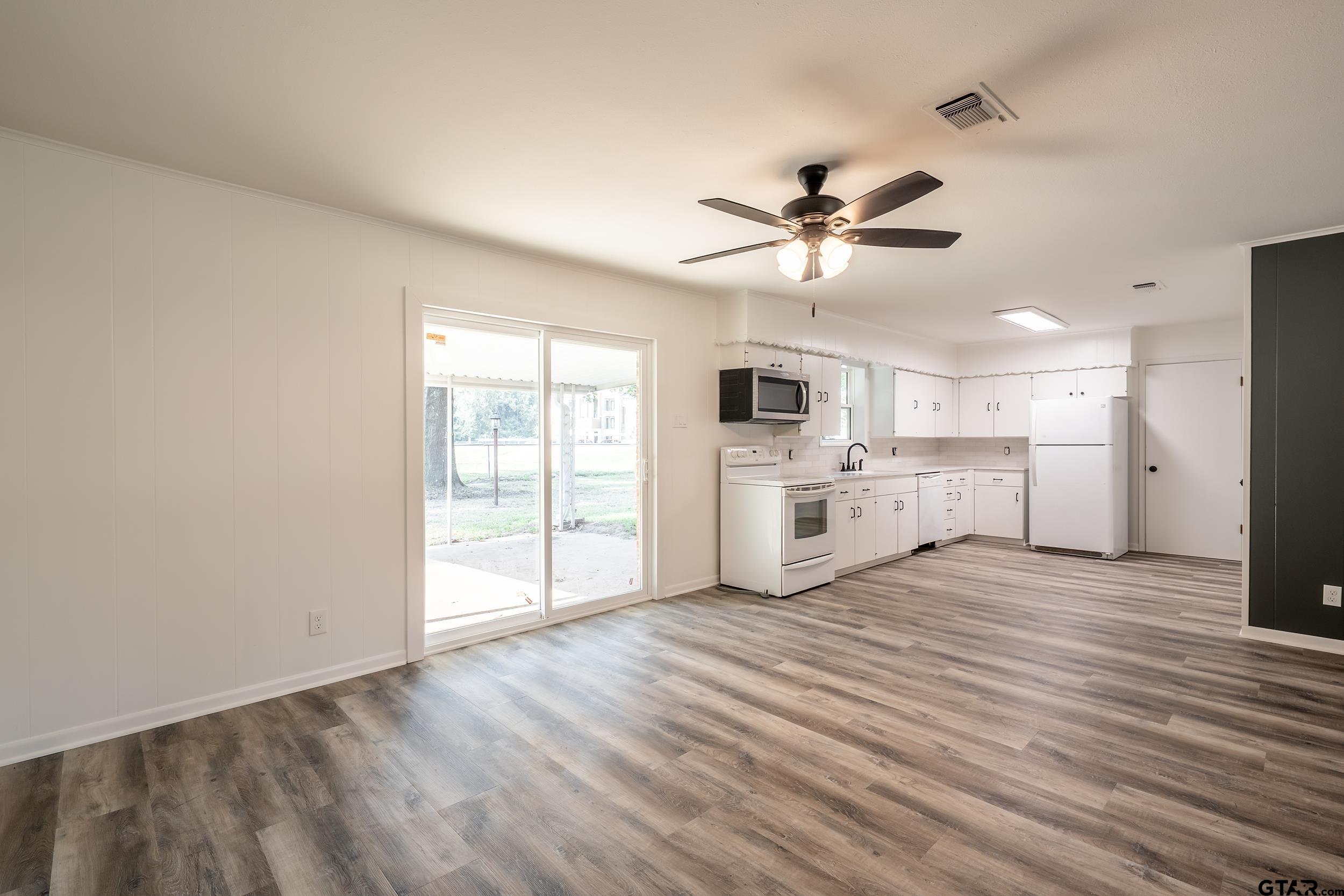 2201 King Road Jacksonville, TX 75766 - Photo 7 of 24 a view of a kitchen with a sink and a window
