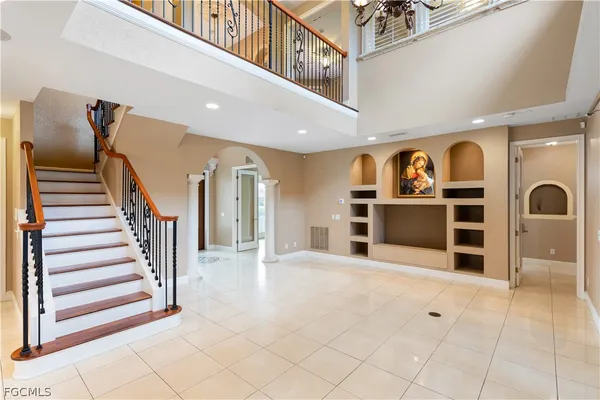 a kitchen with stainless steel appliances granite countertop a refrigerator a oven a sink and a stove