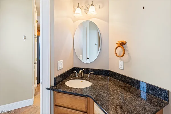 a view of a hallway with wooden floor and stairs