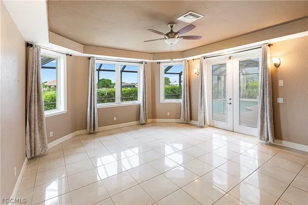 a bathroom with a granite countertop tub sink and mirror