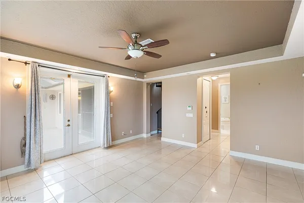 a view of staircase with white walls