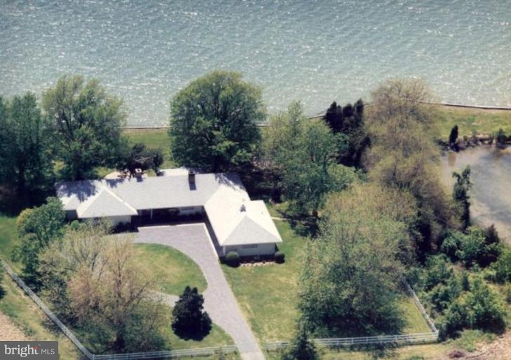 7188 Drum Point Road St. Michaels, MD 21663 - Photo 1 of 19 an aerial view of a house with outdoor space
