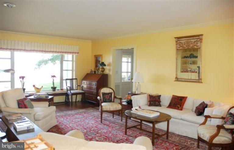 7188 Drum Point Road St. Michaels, MD 21663 - Photo 11 of 19 a living room with furniture and a large window