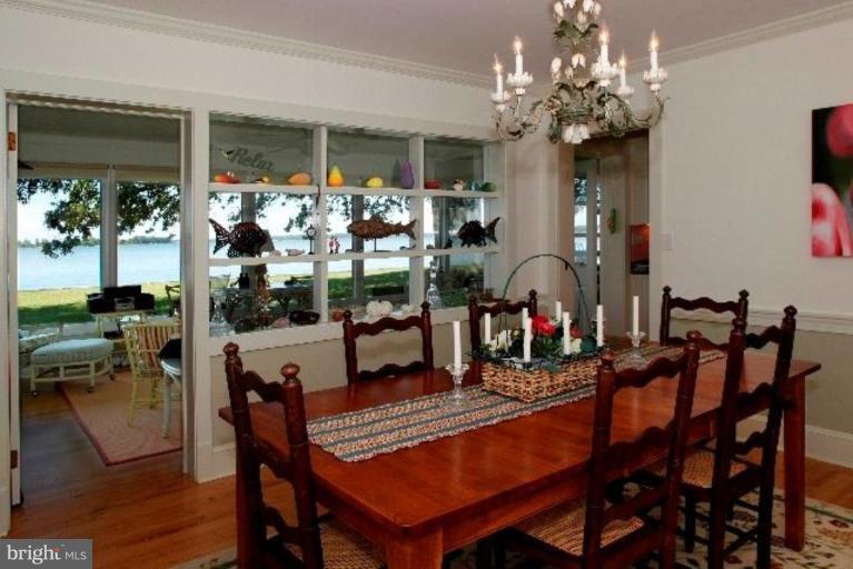 7188 Drum Point Road St. Michaels, MD 21663 - Photo 12 of 19 a view of a dining room with furniture window and outside view