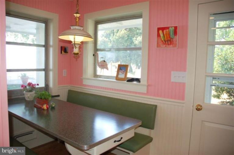 7188 Drum Point Road St. Michaels, MD 21663 - Photo 17 of 19 a room with furniture and window