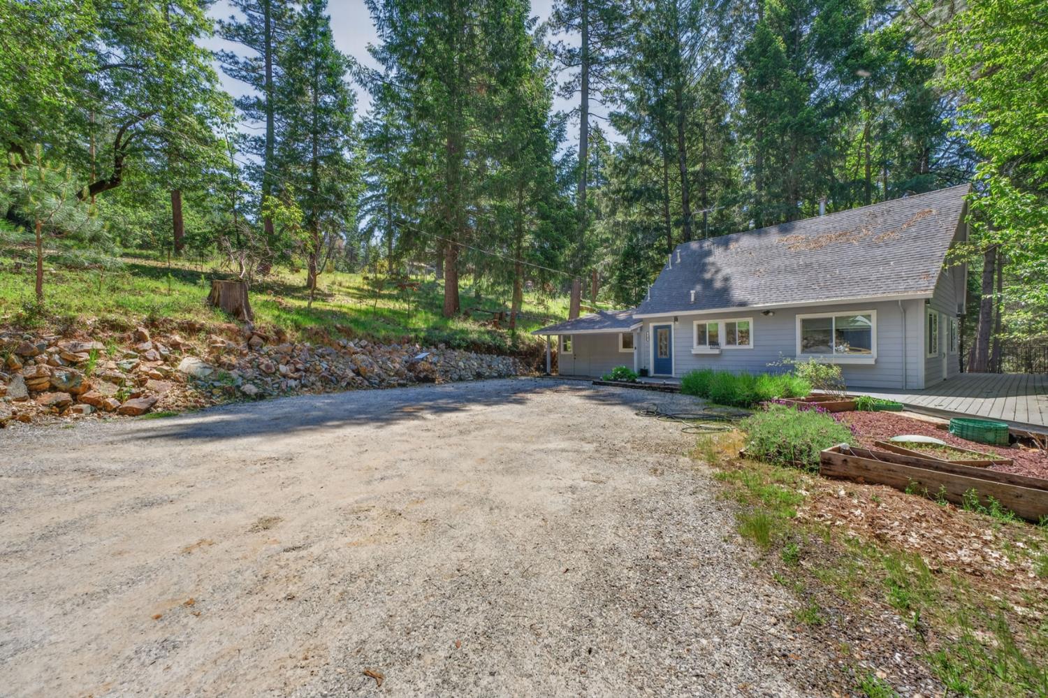 4340 Fairglade Road Placerville, CA 95667 - Photo 1 of 42 a view of a house with a yard and large tree